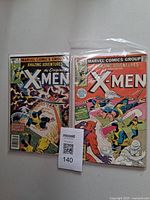 Both comic books bagged side by side