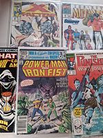 Five bagged Marvel comics fanned out