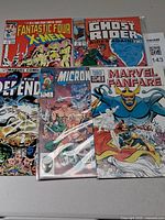Group shot of all five bagged comic books