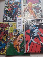 Group shot of five bagged Marvel comics showing all titles