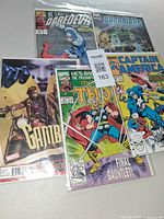 Group shot showing all five bagged comics