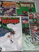 Group of six bagged Marvel comics showing Weapon X, Wolverine and X-Mas Special covers