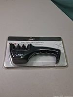 Front view of Master Chef three-stage knife sharpener in sealed package