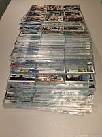 Side view of stacked plastic pages filled with NHL cards