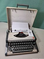 Olympia Traveller de Luxe typewriter open in carry case