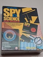 Front of shrink-wrapped Spy Science Secret Message Kit box