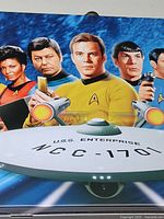 Front panel showing Kirk, Spock, McCoy, Uhura, Sulu, Chekov with USS Enterprise text