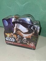 Front view of sealed Star Wars puzzle tin showing Captain Phasma artwork and 1000 pieces label