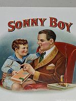 Close-up of father and son vignette and Sonny Boy title