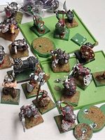 Group of painted miniatures, movement trays, bases