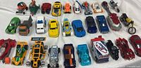 Full lot of 30 assorted vehicles laid out in three rows