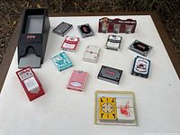 Overall view showing dealer shoe, shot glass set and all playing card decks