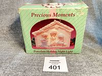 Front of original box showing Precious Moments branding and night light image