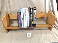 Front view of bookshelf with all seven books visible