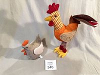 Both fabric chickens side by side with scale card