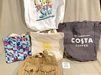 Group shot of all five tote bags