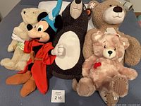 All five plush toys laid out together