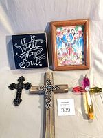 Group shot of both signs and three crosses