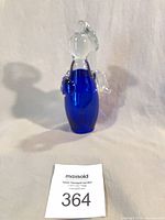 front view of cobalt and clear glass angel figurine with lot tag
