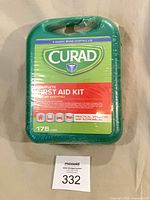 Front view of sealed Curad first aid kit