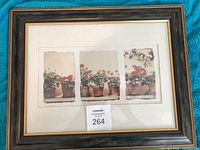 Front view of framed geranium print triptych