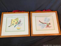 Both framed prints side by side showing frames and art