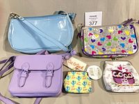 Group shot of all five bags and purses