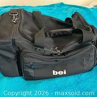 Overall view of black Golden Pacific BEI duffel showing size and handles.
