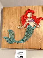 Full view of string art on wood