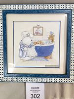 Full view of framed print showing artwork and decorative frame