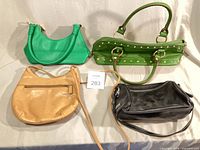 Overview of four small leather handbags
