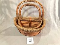 Nested pair of wicker baskets front view