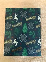 Closed gift box with Lucky Brand graphics