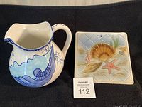 Pitcher and trivet side by side showing scale and design