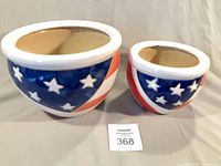 Both ceramic flowerpots front view