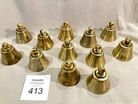 All twelve brass bells displayed