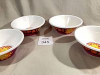 Four Kellogg’s plastic bowls grouped to show exterior graphics and quantity
