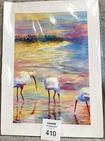 Full view of print showing three birds, sunset colors, signed and numbered, with protective plastic