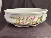 Right side view showing floral Genista & Digitalis design and gold rim