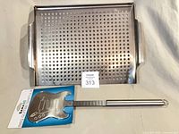 Grill basket and packaged guitar spatula overview