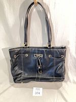 Full view of black leather handbag showing overall style and condition