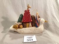 Full view of carved wooden Noah's Ark figurine