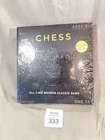 Front view of shrink-wrapped chess game box