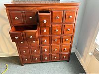 Front view showing all drawer fronts and knobs