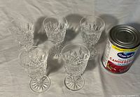 Five crystal liqueur glasses with can for scale