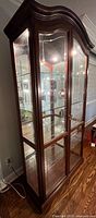 Full view of closed curio cabinet