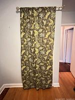 Single curtain panel hung on rod