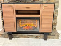 Front view of cabinet with fireplace insert, doors closed