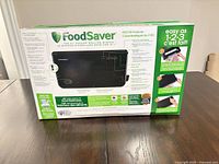 Retail box showing FoodSaver FM2100 vacuum sealer