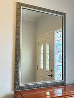 Front view of rectangular silver framed mirror showing entire piece